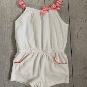 White terry romper with red accents
